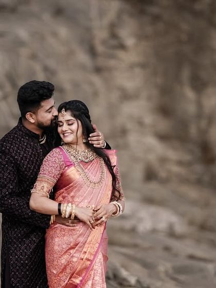 A similar pose from the same session, this time with the groom whispering to the bride, creating a sense of a shared secret.