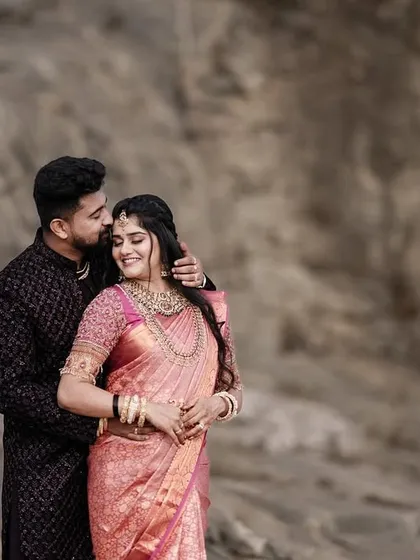 A similar pose from the same session, this time with the groom whispering to the bride, creating a sense of a shared secret.