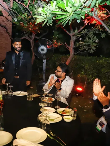 The moment of the big reveal. The applause and smiles from the guests at this corporate dinner show that the prediction was a huge success.