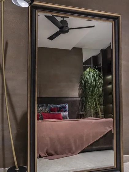 In a room kissed by the sun, I used darker hues to create a cozy, inviting master bedroom. This space balances light and shadow, offering a restful retreat that feels both warm and sophisticated.