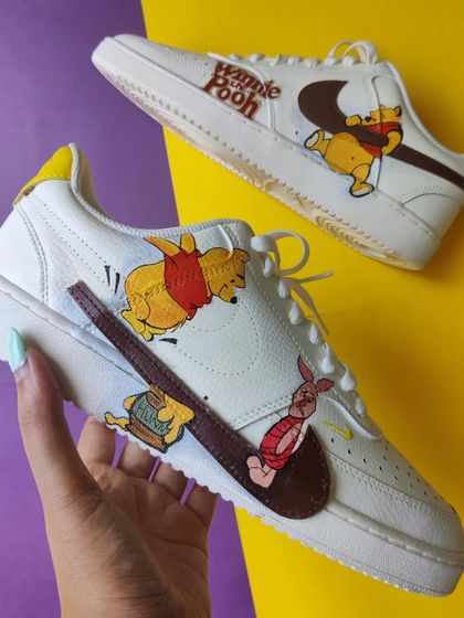Another shot of the Winnie the Pooh custom, showing all the characters playing around the swoosh.