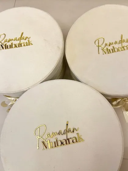 A stack of my signature velvet Ramadan hampers, ready to be filled with curated goodies.