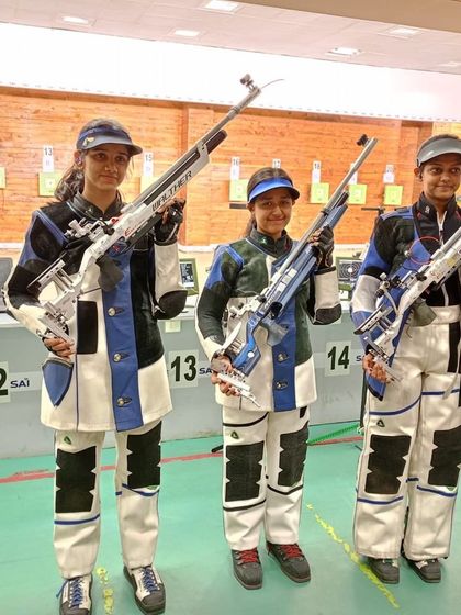 Our team of female rifle shooters, equipped and ready for their training session. They are holding professional-grade Walther air rifles, the same type used in top-tier competitions.