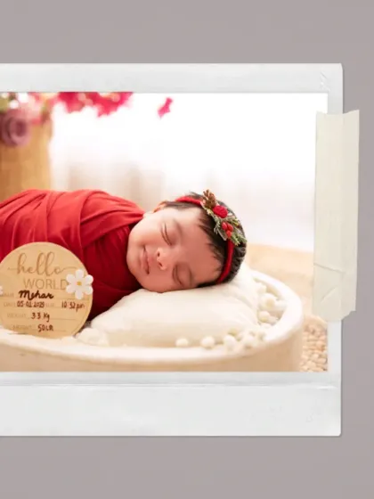 "Hello World." This sweet shot includes a custom wooden plaque to announce your baby's arrival details, making it a perfect birth announcement photo.