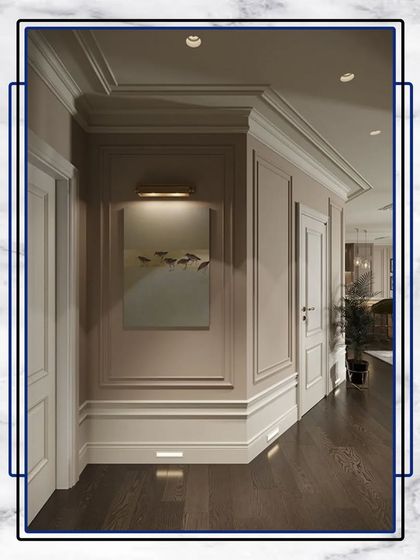 A corner detail showing the craftsmanship of our wall paneling and crown molding. These elements add architectural interest and a sense of history and permanence to the space.