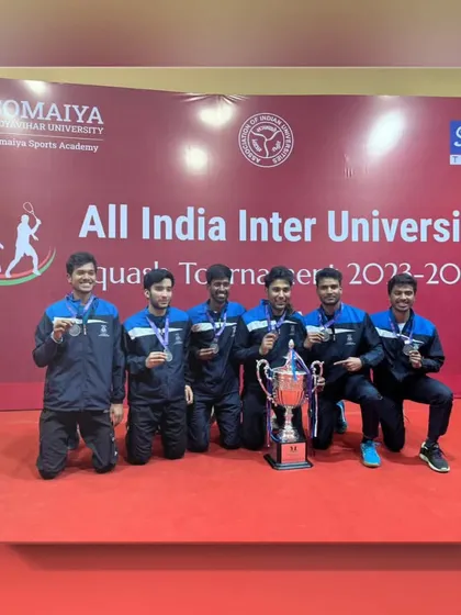 The full university team with their silver medals and runner-up trophy. A proud achievement that reflects our comprehensive player development program.