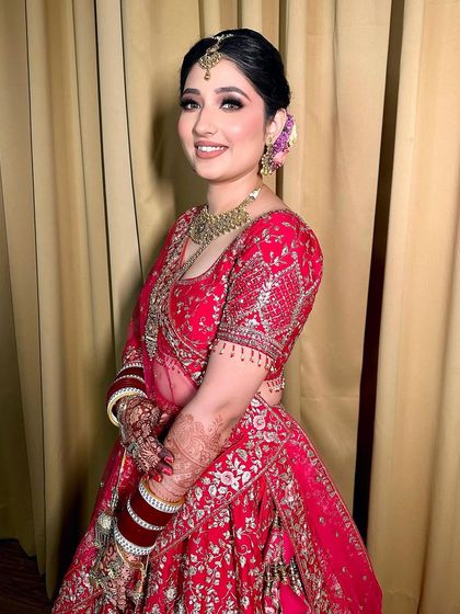 Another angle of this happy bride, showing how the makeup looks beautiful and natural as she smiles.