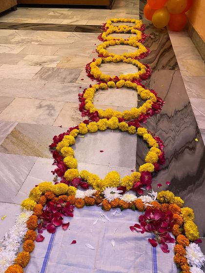 This shows the length of the floral pathway I can create, leading the bride into her new home. Each section is carefully arranged with marigolds and rose petals.