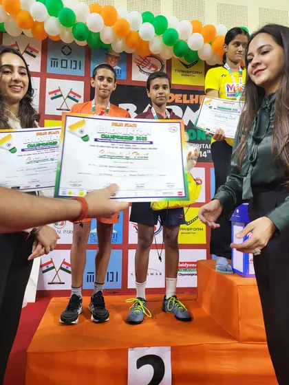 The award ceremony for the Mixed Doubles U-15 category, with our players Sneha and Aryan receiving their silver medals.