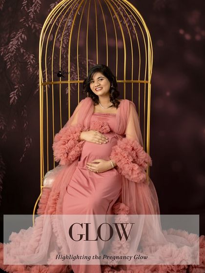 The golden swing is a versatile prop that helps create stunning seated portraits. Here, the mom-to-be glows in her pink gown, perfectly framed by the elegant structure.