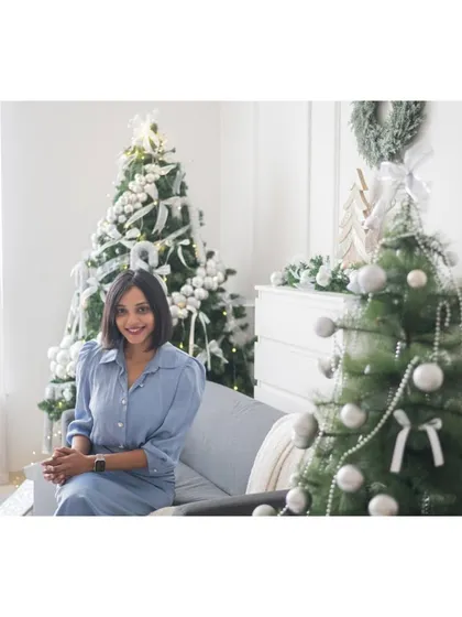 A simple, elegant portrait from a Christmas mini-session. The beautiful white and silver decor of the studio provides a perfect backdrop for a classic holiday photo.