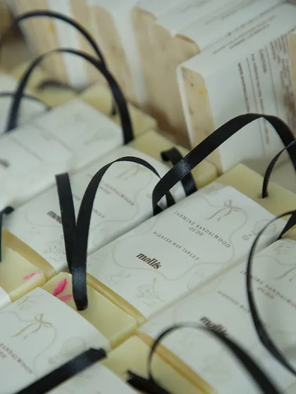 The Jasmine Sandalwood & Oudh scented wax tablets with elegant black ribbons.