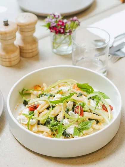 A fresh summer pasta dish from our seasonal menu. We toss pasta with fresh vegetables, herbs, and feta cheese for a light yet satisfying meal.