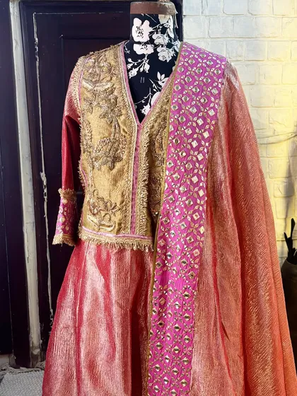 The hand-embroidered yoke adds a touch of royalty to this beautiful suit.