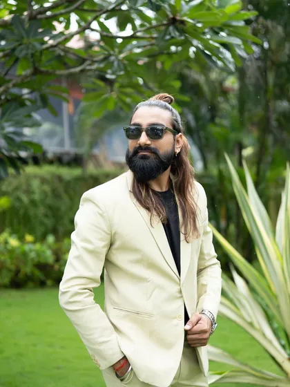 Another look at my personal style. The man bun, beard, and sunglasses are all part of the 'Dancing Bartender' persona that guests love.