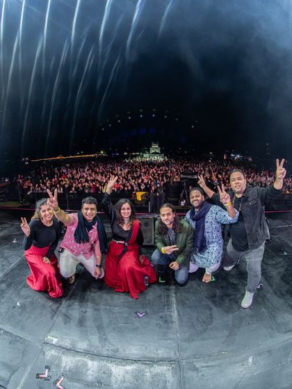 A group photo with my band and the massive audience at Jazz Al Parque behind us. This picture is a beautiful memento of a night filled with incredible music and energy.