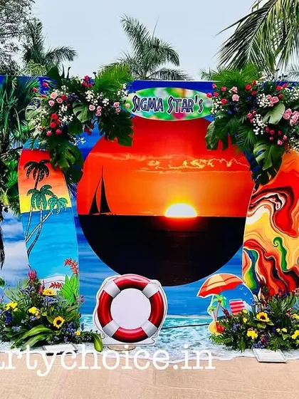 A vibrant beach theme party set up right by the pool. We used a stunning sunset backdrop, surfboard props, pink flamingos, and tropical flower arrangements to create a perfect summer vibe for this corporate event.