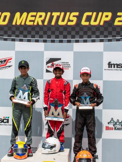 The official podium shot for the Meritus Cup 2023, with our driver Rishik in his red Birel ART race suit, proudly holding his trophy.