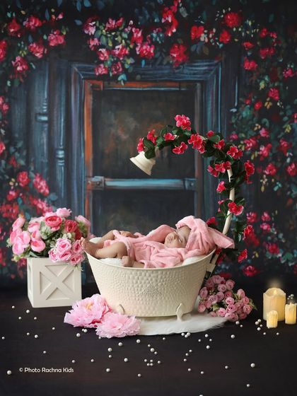 The complete setup for our floral bath-time theme, creating a dramatic and beautiful portrait with a dark, rose-covered background.