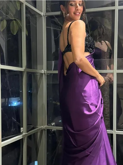 I styled Tripti Dimri in this elegant purple satin saree from Swtantra, paired with a contrasting black sequin blouse. The look is simple, modern, and incredibly chic, proving the power of color and texture.