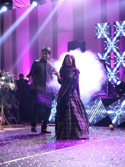 Surrounded by smoke and lights, this couple owned the stage. We help manage all the technical aspects like lighting and special effects to elevate your performance.