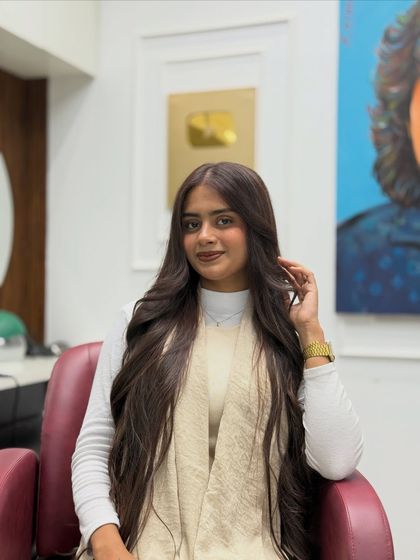 This is what I call an "expensive brunette" look. A deep, decadent chocolate brown on very long hair, styled to show off its health and shine.