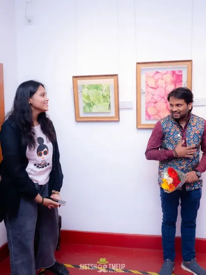 Sharing a light moment at the TCC exhibition. The art world is a community, and I encourage my students to be an active part of it.