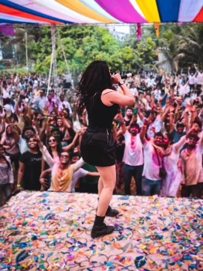 The joy of a Holi festival. Performing for a massive crowd covered in colors is a uniquely vibrant and energetic experience.