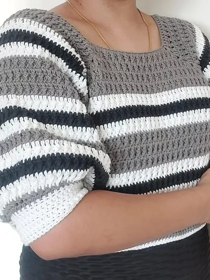 A side view of the Diana Crop Top, highlighting the voluminous puff sleeves.
