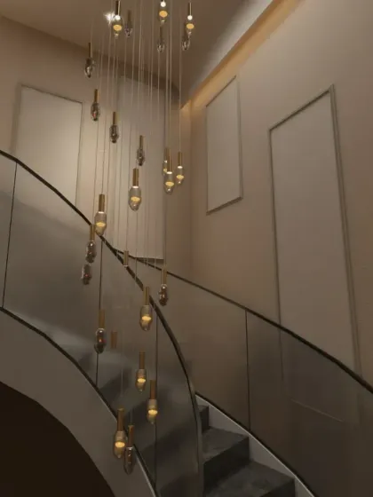 A grand entrance sets the tone for any luxury space. In this Gurgaon residence, I designed a double-height foyer featuring a cascading chandelier that serves as a stunning focal point, demonstrating how lighting and scale can be used to create dramatic first impressions.
