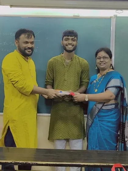 A student being felicitated during the Diwali event. We take every opportunity to encourage and celebrate our students.