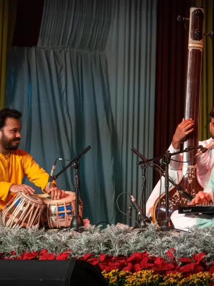 A gallery of cherished moments accompanying the legendary vocalist, Guruji Padma Bhushan Pandit Ajoy Chakraborty ji, at various prestigious festivals.