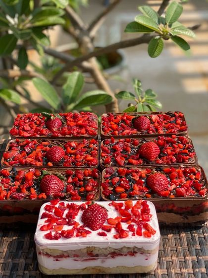 Our fresh strawberry desserts are perfect for parties. Here you can see our chocolate strawberry tubs and a strawberry and cream tub, all packed with fresh fruit.
