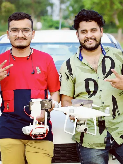 My team and I with our drone fleet, ready for an outdoor shoot. Having multiple drones like the DJI Air 2S ensures we have the right equipment for any situation.