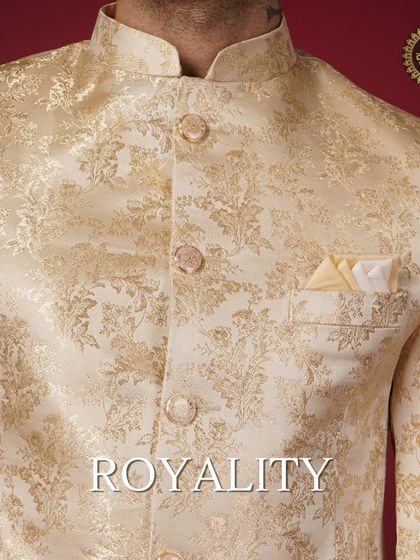 Royalty. A close-up of a golden brocade jacket, showcasing its rich texture and regal appeal.