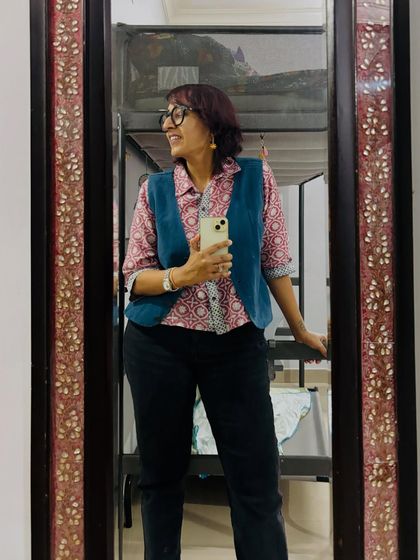 A candid moment while taking a mirror selfie. Fashion should be fun and expressive.