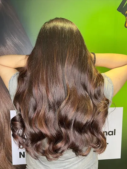 Another view of the wine red balayage, showing off the rich tones and healthy shine.