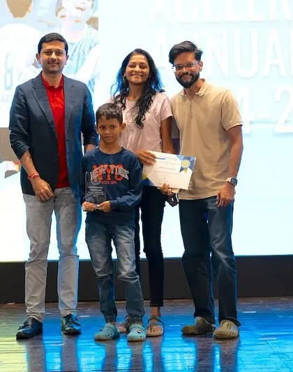 An individual award winner from our U9 Xcelerate team with his family.