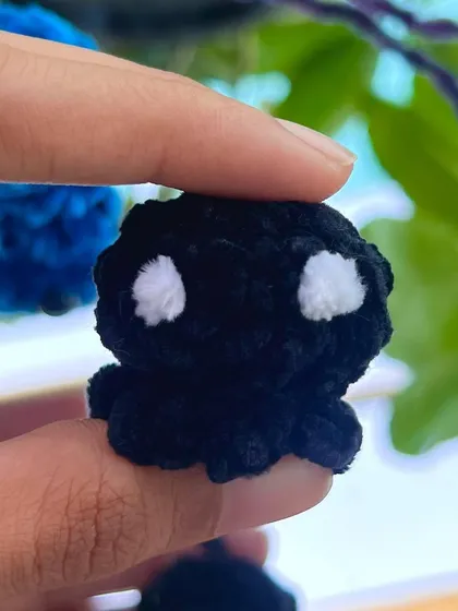 For those who prefer a classic look, I also make the mini octopus keychain in black with contrasting white eyes.