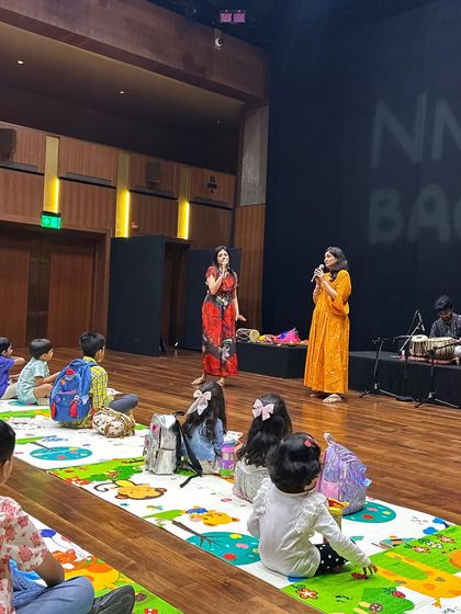 A view from the audience at our NMACC folk music workshop. We create a comfortable and informal setting, allowing children to sit up close and feel fully part of the performance.
