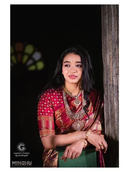 An elegant portrait of Priyanka by the window. The soft, natural makeup look is versatile and timeless, perfect for any wedding event, day or night.