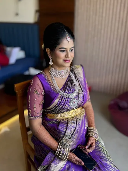 Meghana looking radiant for her Seemantham. We chose a glamorous look with diamond jewellery and a beautiful purple saree, with makeup that highlighted her happy glow.