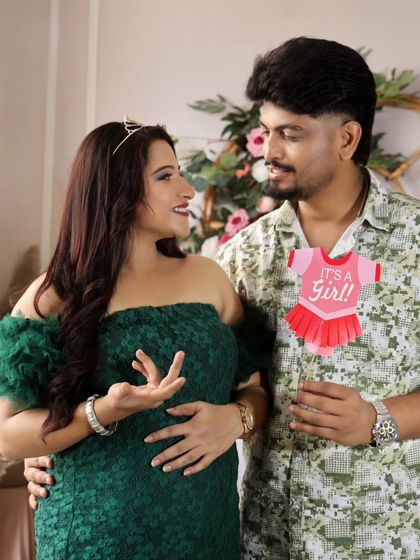 A fun gender reveal for a baby girl! The couple looks so happy and excited in this sweet, candid-style shot.
