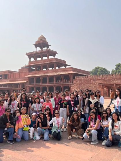A large group of our students gathers for a photo at Fatehpur Sikri. These trips foster a sense of camaraderie and shared discovery as they explore India's magnificent heritage sites together.