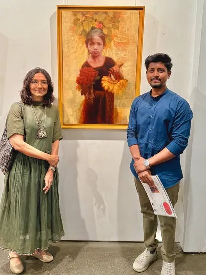 With a guest at the Kalanand Award exhibition, standing next to my painting "Hope of Innocent Flowers."