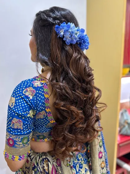 Beachy waves with a crown of blue hydrangeas, a fresh and unique look for a daytime event.