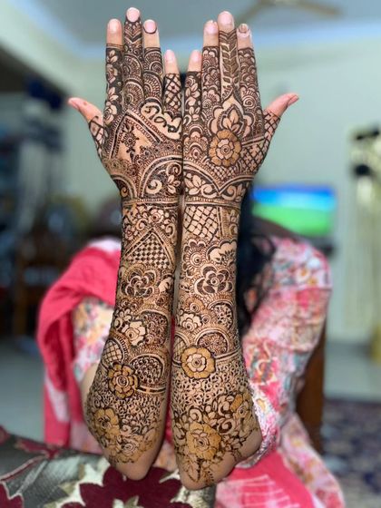 Another beautiful design for my brother's wedding celebrations. This one features a lovely mix of floral and paisley elements.