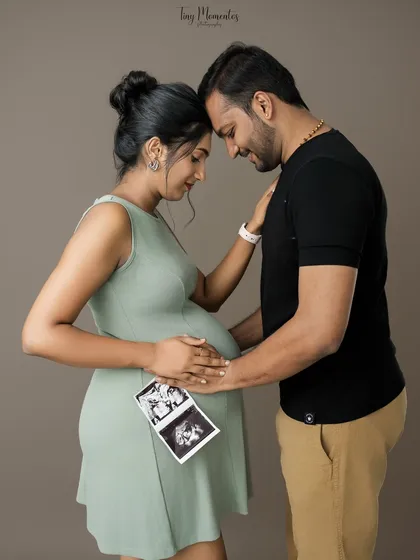 Your story is in the details. Bringing personal items like your first ultrasound scan adds a deeply meaningful touch to your couple's maternity session, celebrating your baby from the very first glimpse.