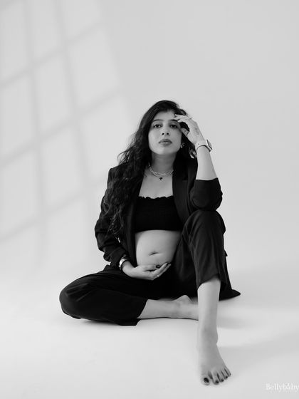 A powerful and vogue-inspired black and white portrait. This shot celebrates the mother's strength and confidence in a modern, stylish way.