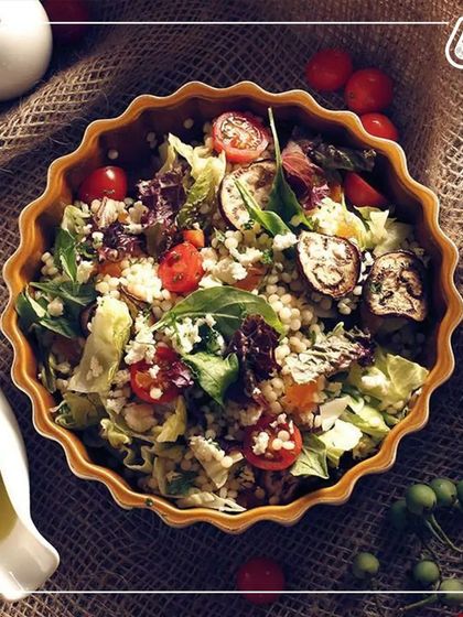 This couscous salad with roasted vegetables is a delightful mix of textures and flavors. It's a light yet satisfying meal that's perfect for a summer lunch.